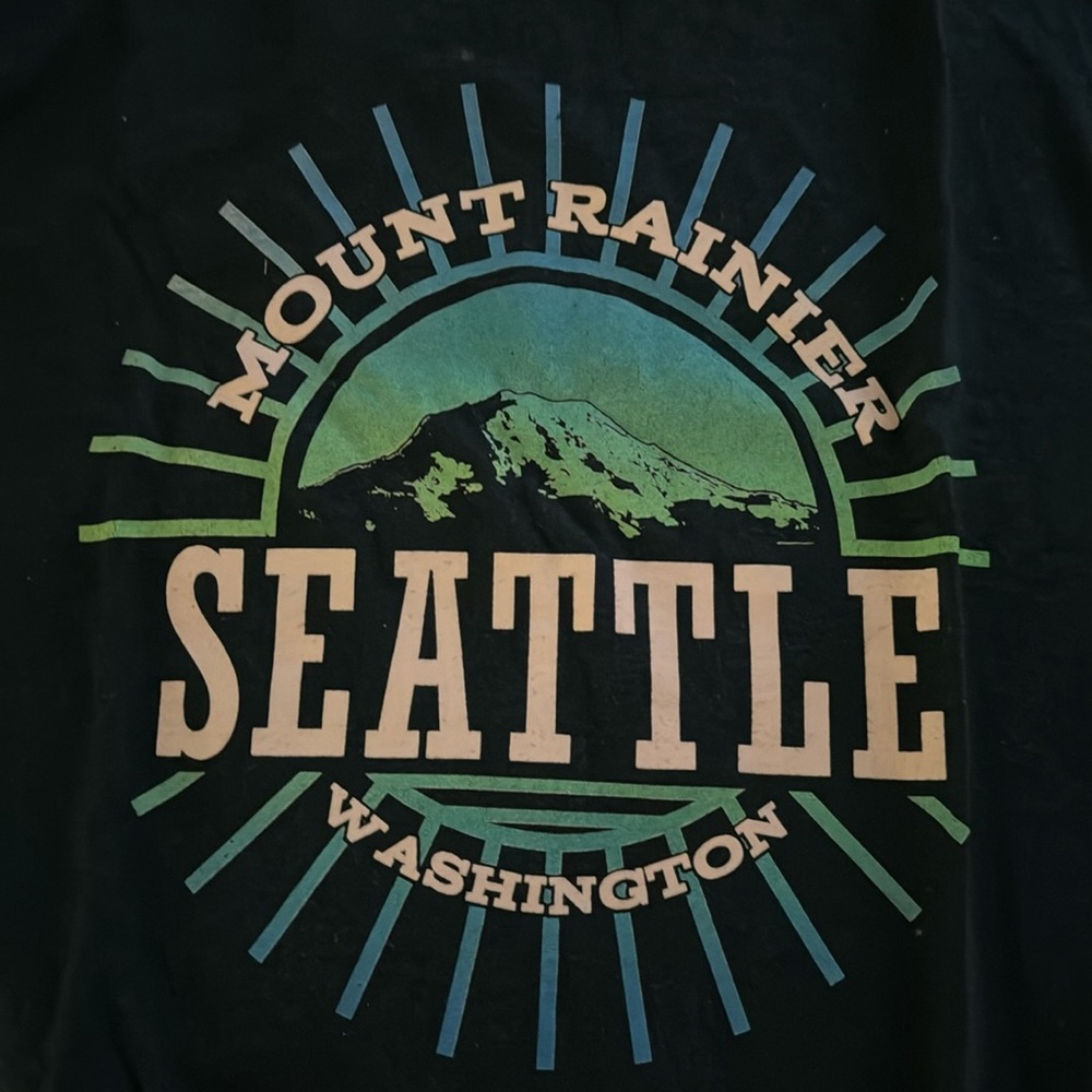 Seattle tshirt, washed twice, color is a very dark teal/blue